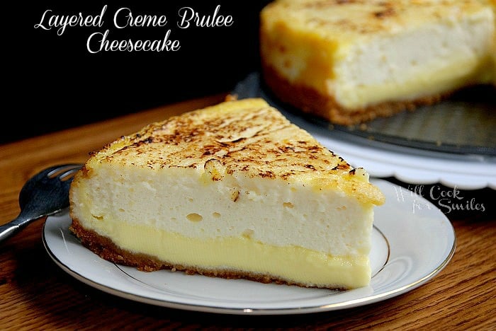 1slice of creme brulee cheesecake on a white plate in front of the rest of the cake in background to the right