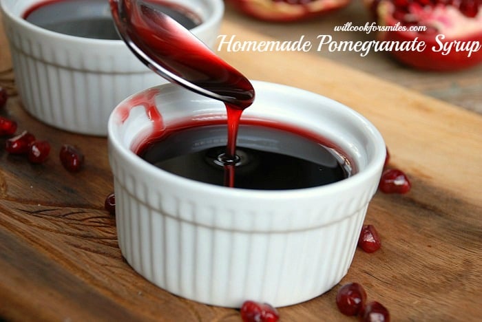 Cup of pomegrantae syrup with spoon