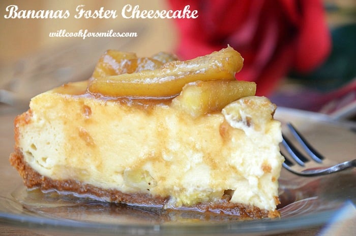 bananas foster cheesecake slice on clear plate with fork