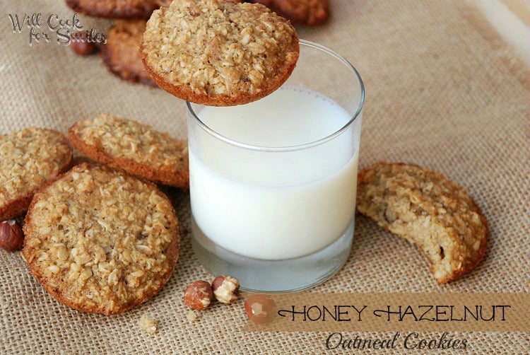 top view of cookies piled on burlap cloth with glass of milk in center of shot