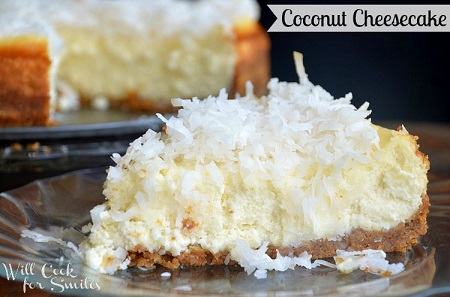 coconut cheesecake slice on a glass plate