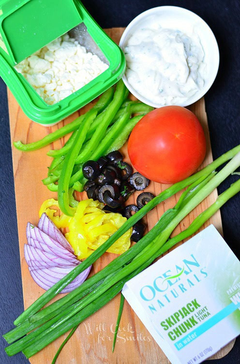 ingredients for Greek Tuna Pita on a cutting board