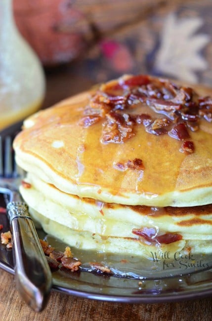 Maple Bacon Pancakes on a plate with a fork on the side