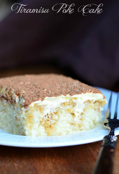 Tiramisu Poke Cake slice on a plate with a fork to the right
