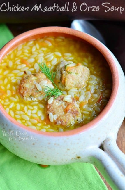 Chicken Meatball Orzo Soup in a white bowl with a green napkin