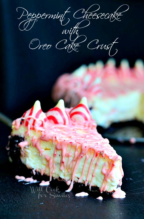 Peppermint Cheesecake with peppermint kisses along the outside slice