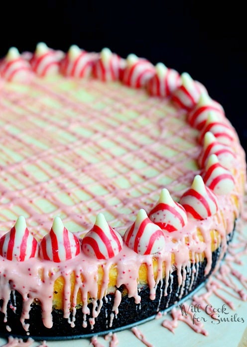 close up view of peppermint cheesecake with oreo cake crust on white table