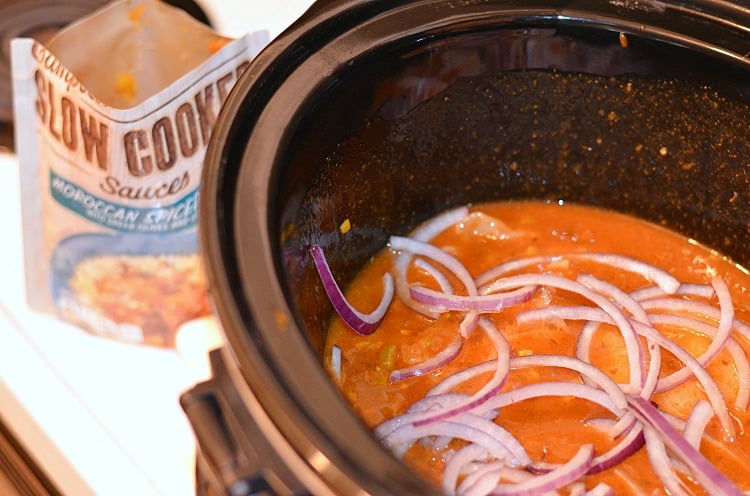 Moroccon Chicken sauce in a slow cooker with red onions