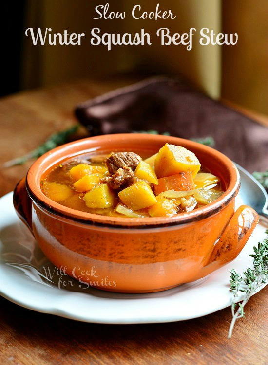 Slow Cooker Winter Squash Beef Stew in an orange bowl