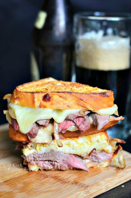 Steak and Onion Grilled Cheese on a cutting board