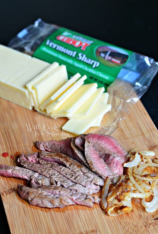 Cheese, Steak, and Onion on a cutting board