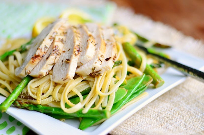 Linguine with Chicken, Asparagus and Snow Peas on a white square plate