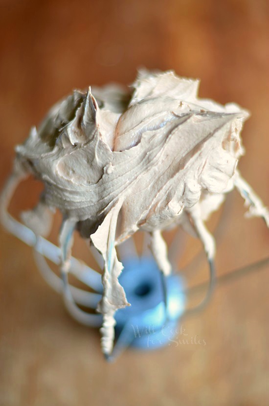 Amazing Chocolate Buttercream Frosting on the end of a whisk