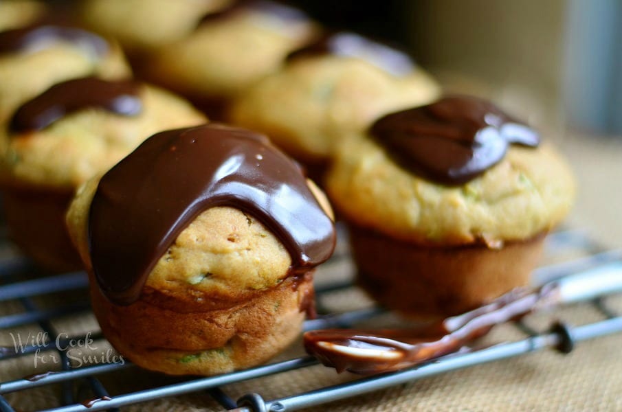 Zucchini Muffins with Hot Fudge Sauce on a cooling rack