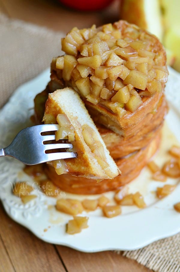 Apple Pie Stuffed French Toast on a plate with a fork with a piece on it