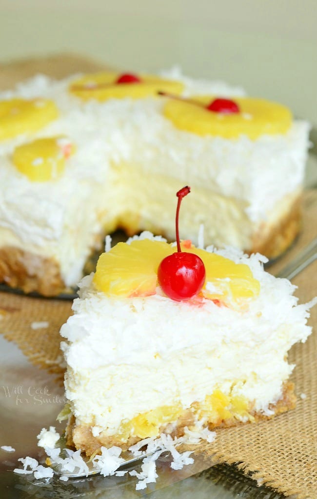 pina Colada Cheesecake with coconut, cherry, and pineapple
