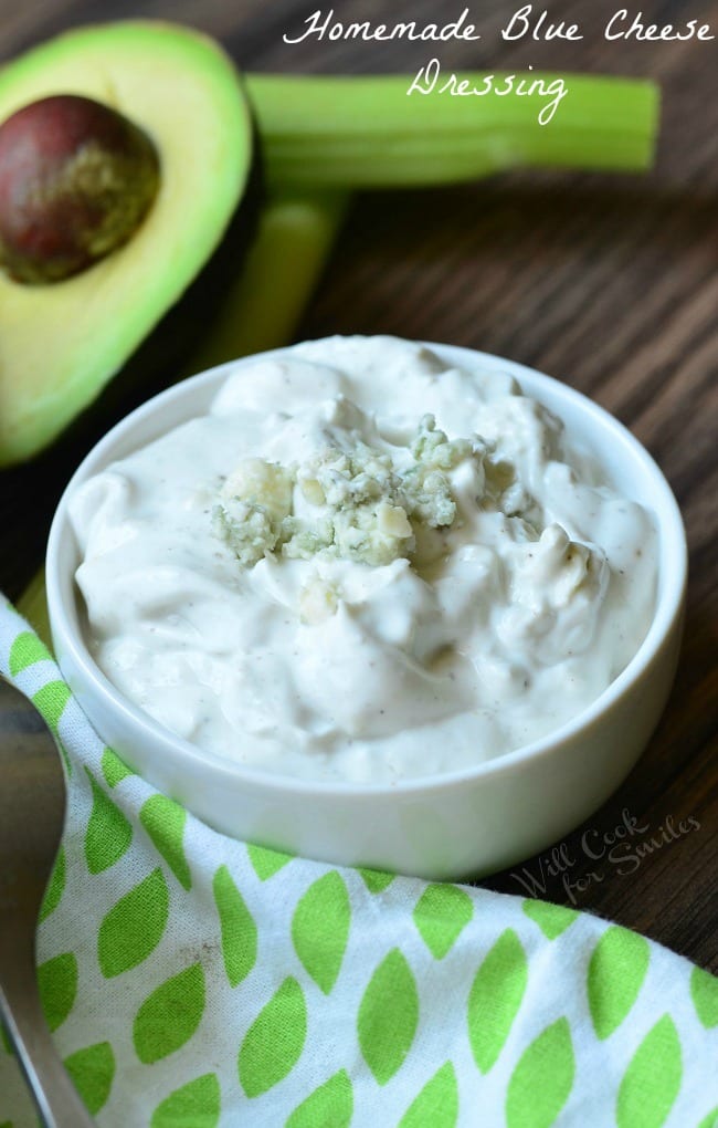 Close up view from above of a small white bowl with homemade blue cheese dressing