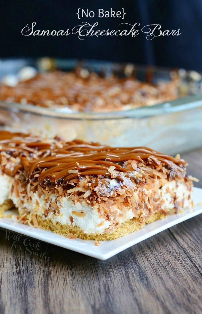 samoas Cheesecake Bars with caramel and toasted coconut on top on a white plate