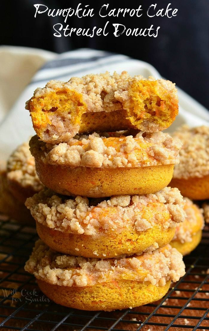 Pumpkin Carrot Cake Streusel Donuts staked up on a cutting board