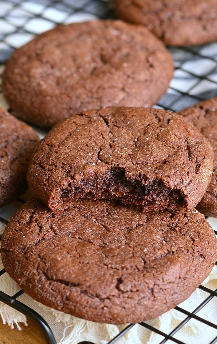 Chocolate Soft Gingersnaps with a bite out of it on a cooling rack