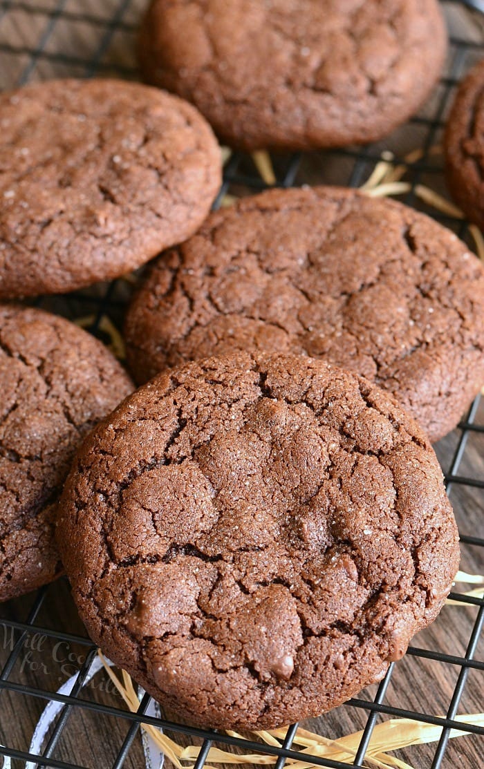 2 chocolate chocolate chip gingersnap cookies on a cooling rack