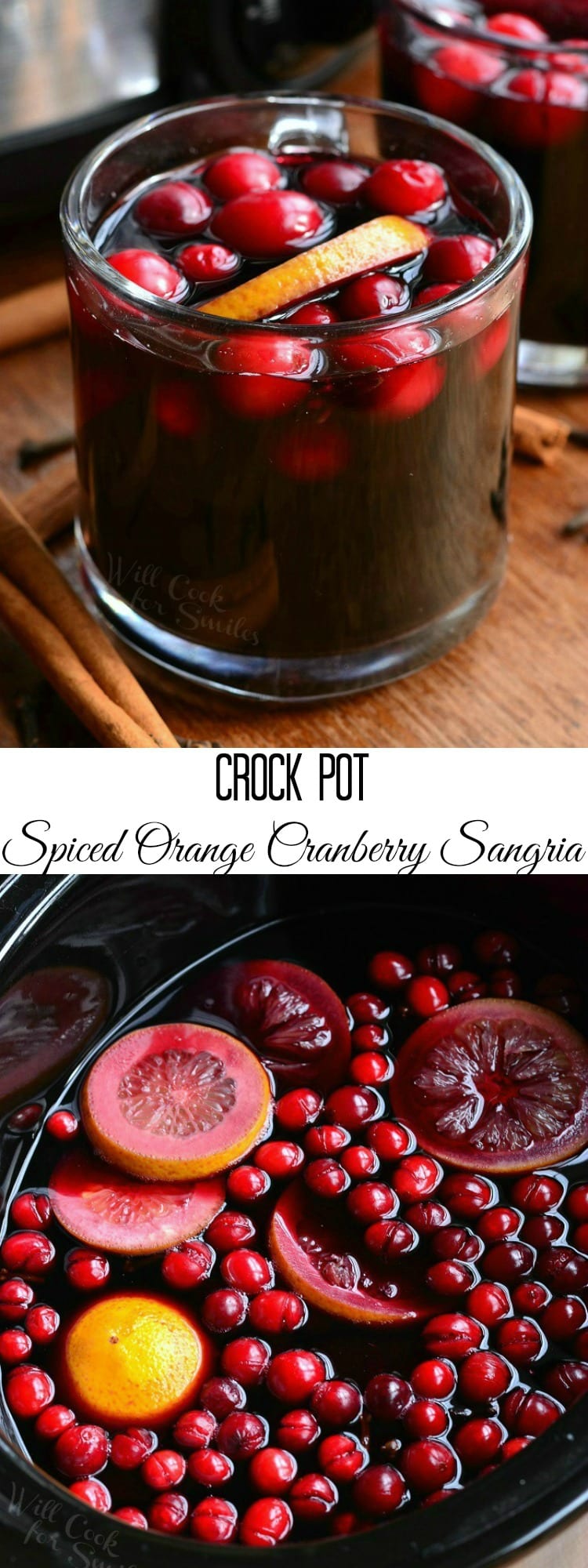holding Orange Cranberry Sangria in a glass mug with orange and cranberries inside