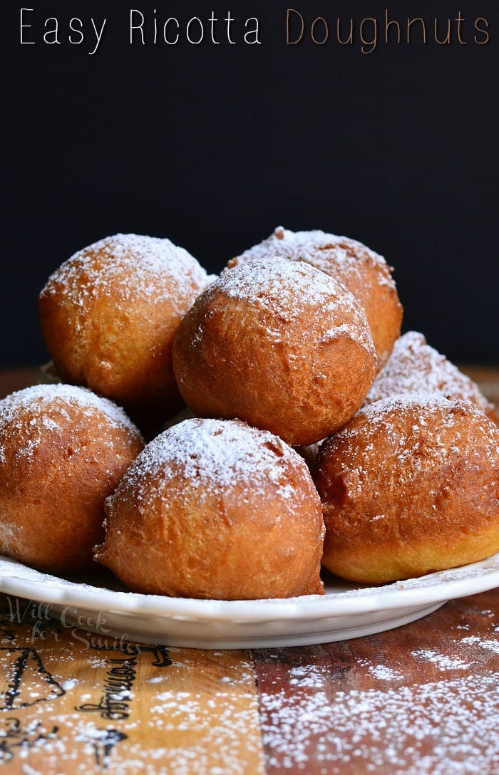 Easy Ricotta Doughnuts stacked up on a white plate