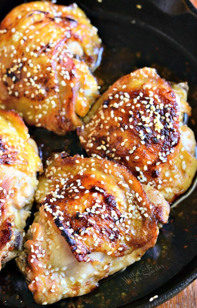 Skillet with sesame roasted chicken thighs as viewed from above
