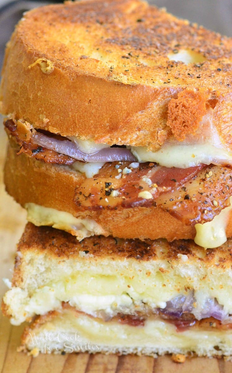 Pepper Bacon grilled cheese cut in half on a cutting board