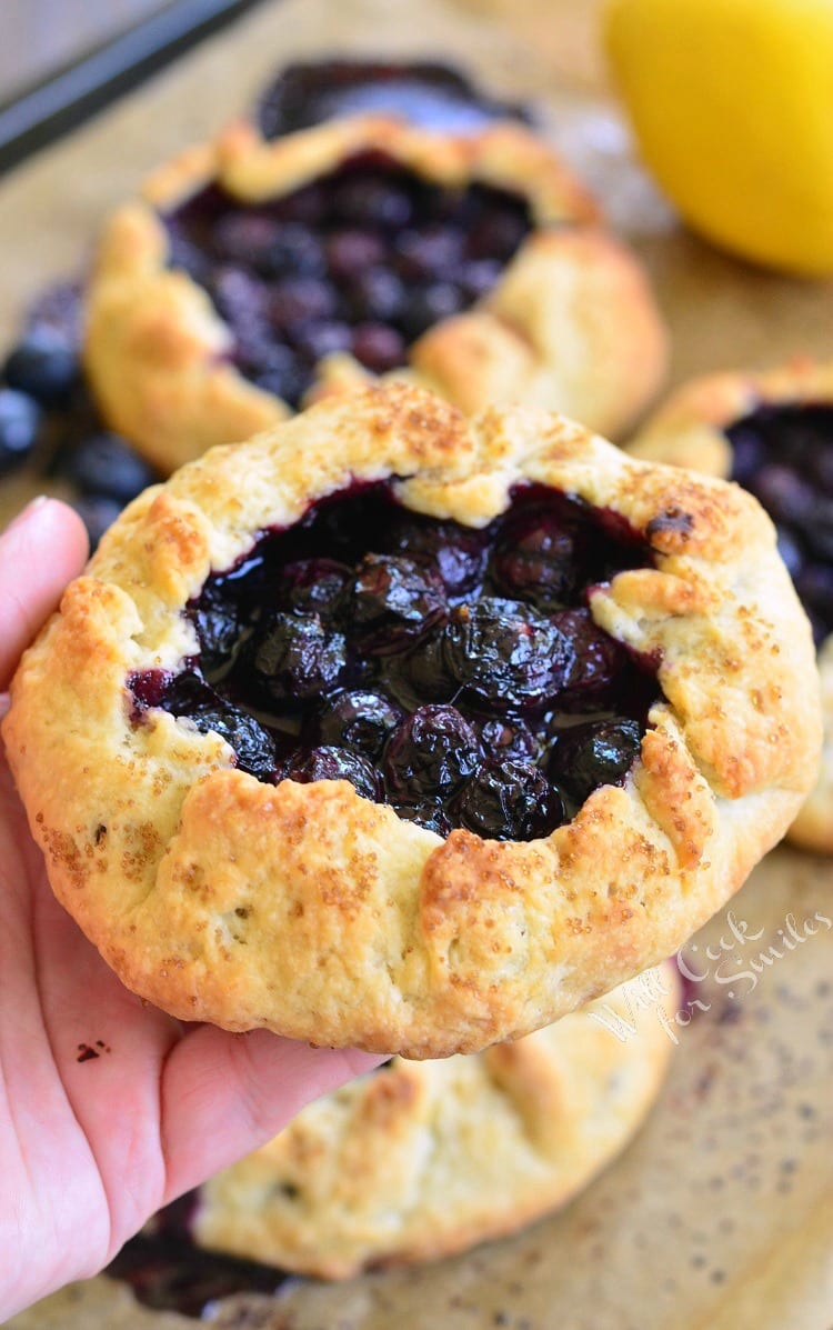 holding a Blueberry Vanilla Lemon Galette