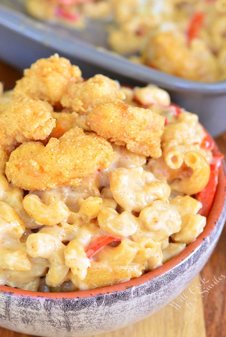 Po'Boy Mac and Cheese with fried shrimp on top in a bowl