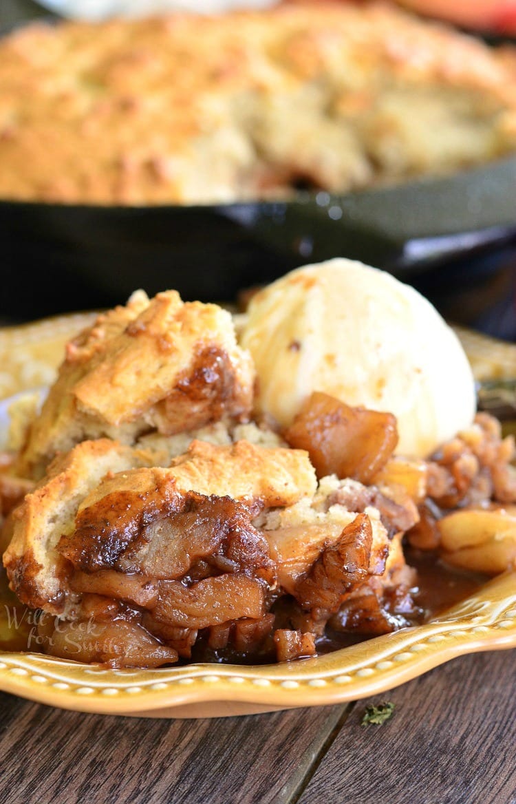 Maple Pecan Apple Cobbler with ice cream on a yellow plate