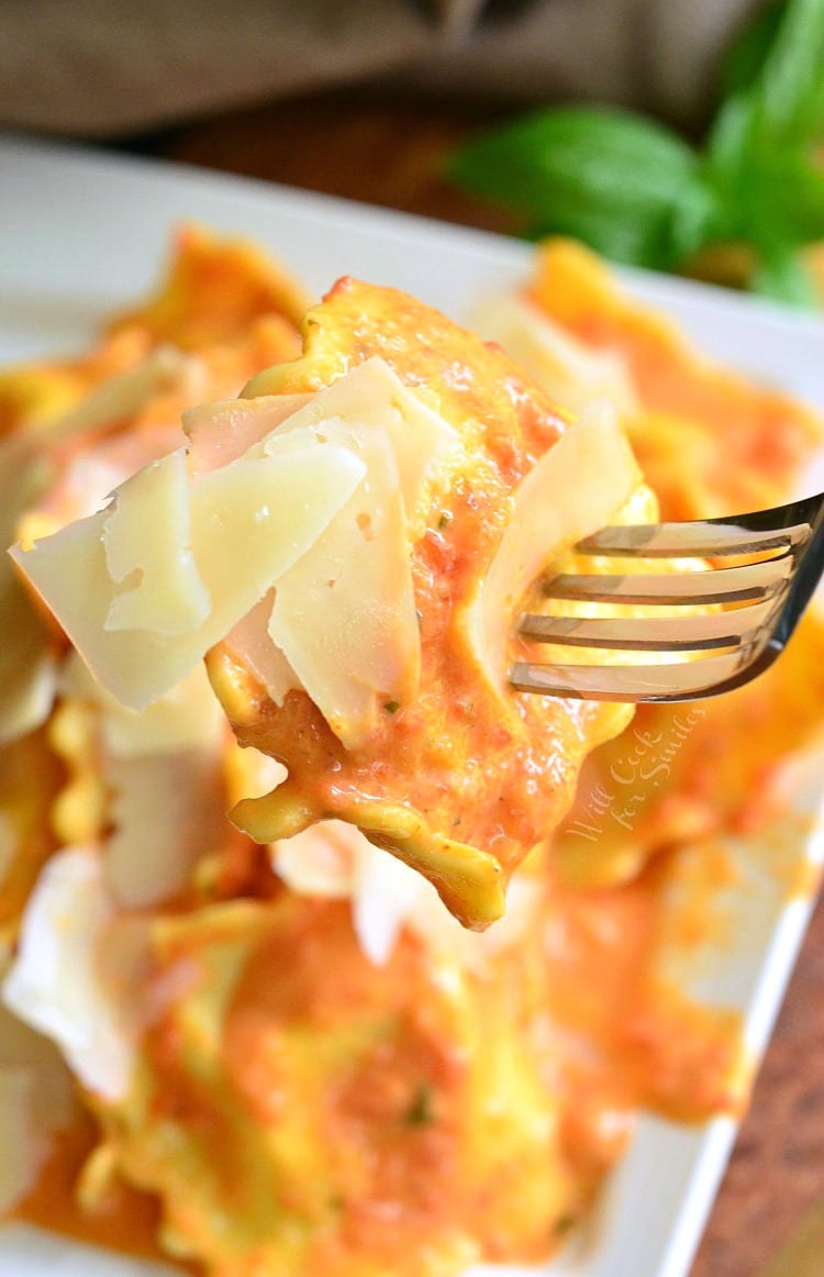 Ravioli being lifted off plate with a fork