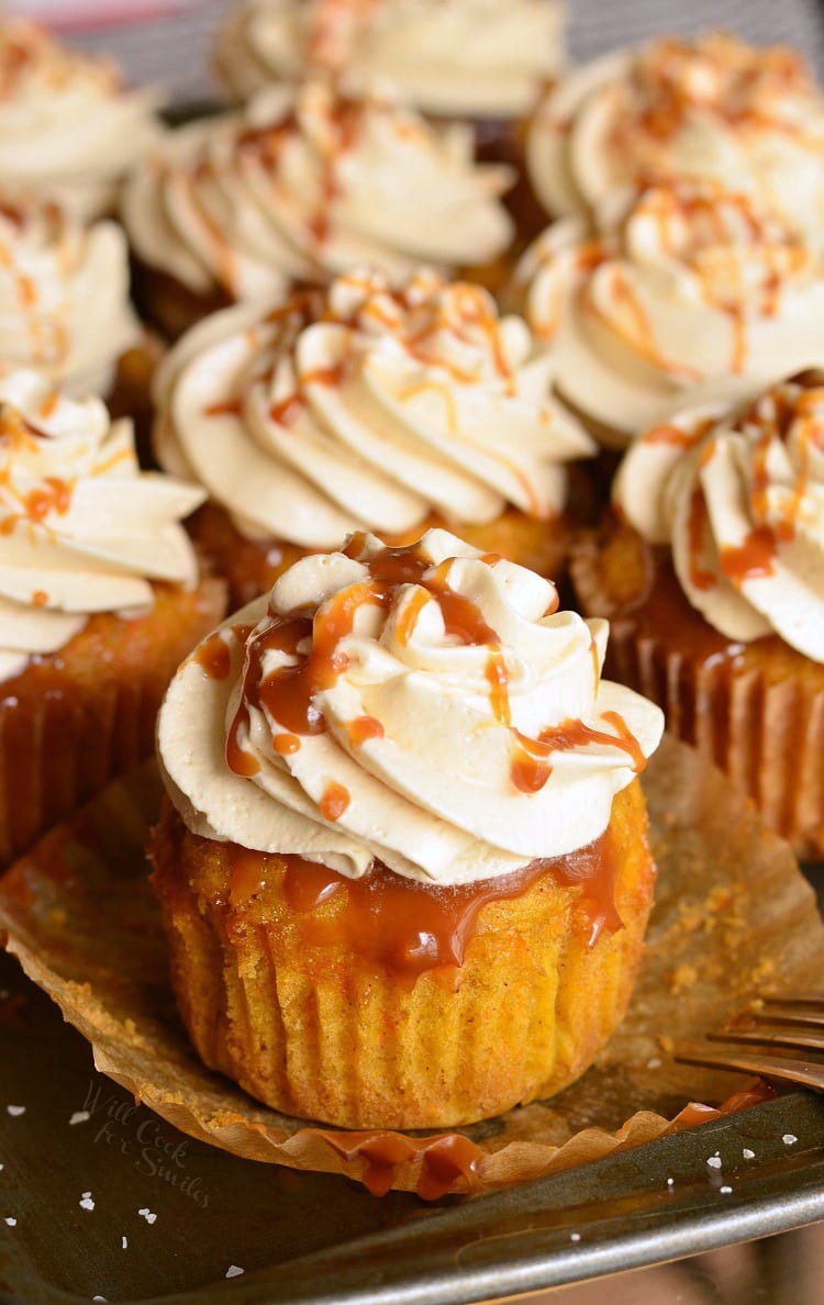 Salted Caramel Carrot Cake Cupcakes on a baking sheet