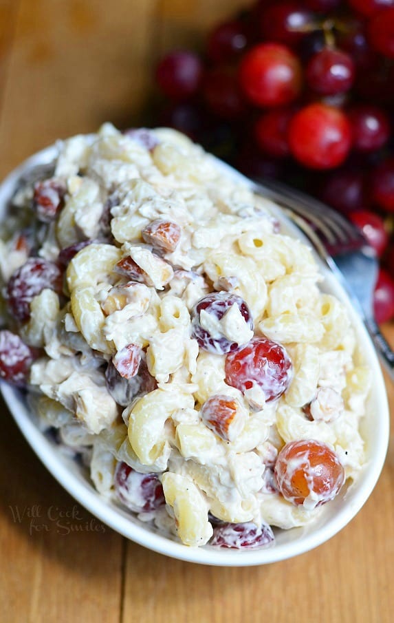chicken macaroni salad with grapes in creamy dressing in a bowl.