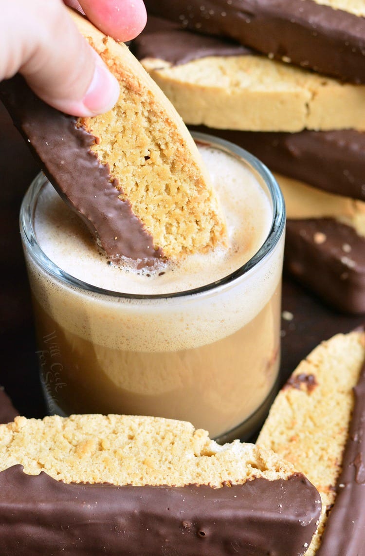 dipping Dark Chocolate Cappuccino Biscotti in espresso