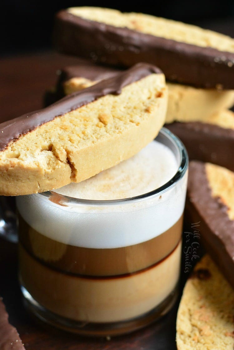 Dark Chocolate Cappuccino Biscotti across mug with espresso in it