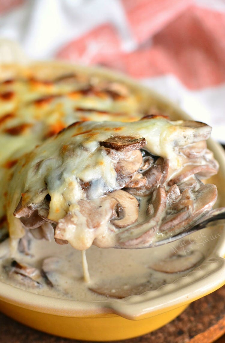 Creamy Russian Mushroom Julienne in casserole dish with a spoon