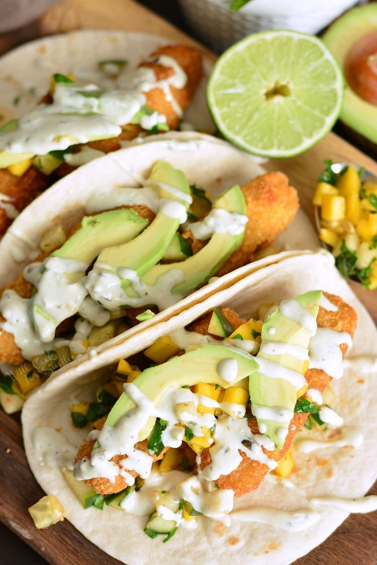 Crispy Fish Tacos with Cucumber Mango Relish on a cutting board