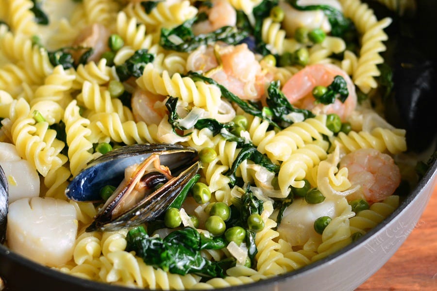 Creamy Spinach and Peas Seafood Pasta in a pan