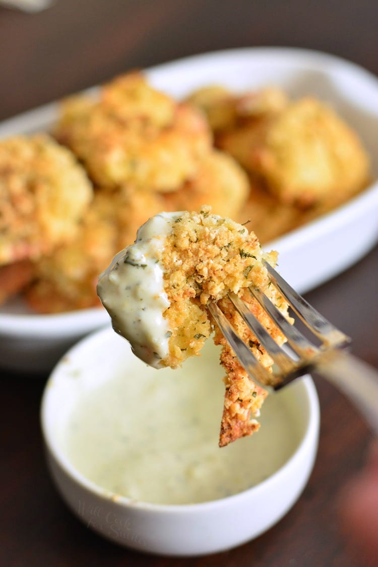 dipping Oven Baked Crispy Parmesan Garlic Shrimp in ranch