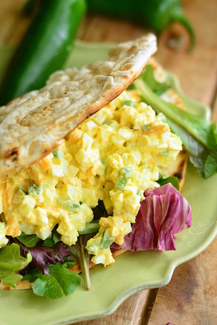 Jalapeno Cheddar Egg Salad in a pita on a plate