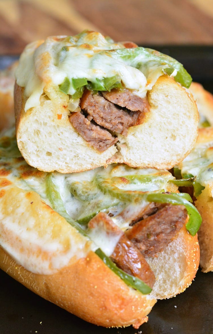 Philly Cheese "Steak" Sausage Hoagies stacked up on a baking dish