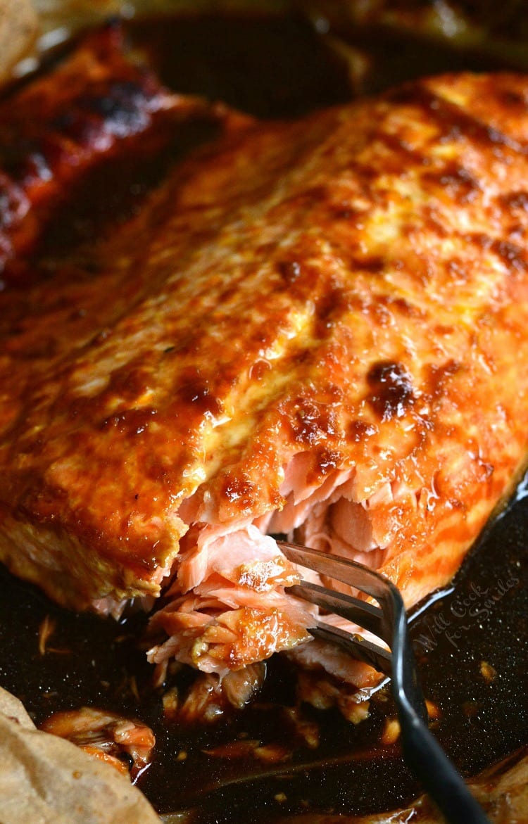 4-Ingredient Orange Salmon in butcher paper on a baking sheet