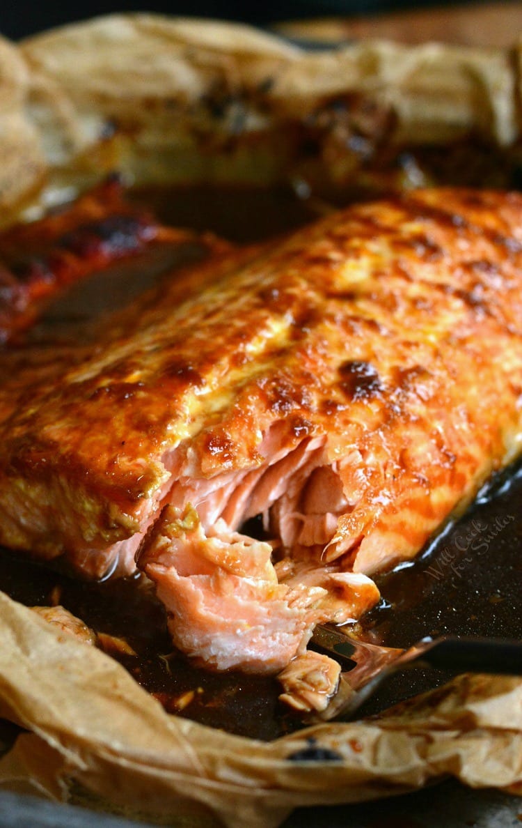 4-Ingredient Orange Salmon in butcher paper on a baking sheet