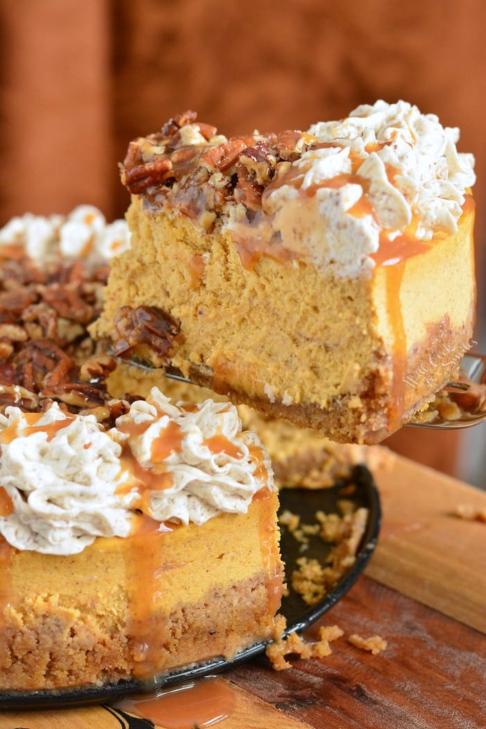 Caramel Pecan Pumpkin Cheesecake on a cutting board