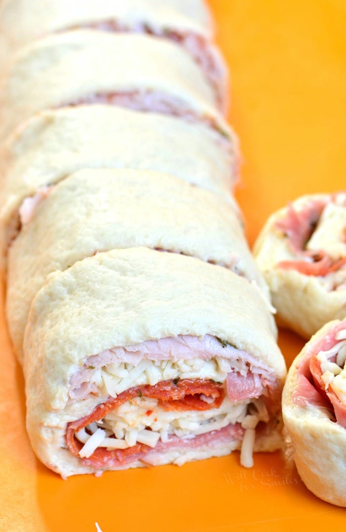 uncooked pin wheels on a cutting board