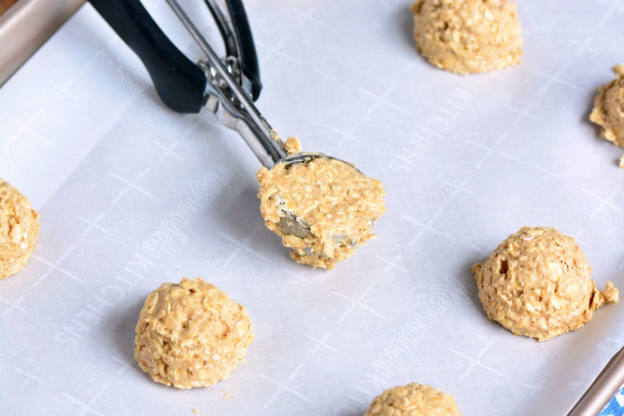 Easy Oatmeal Cookies being scoped onto parchment paper