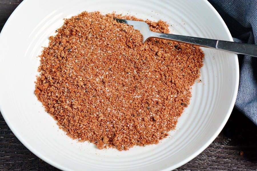 dry rub mixed up in a bowl with a fork