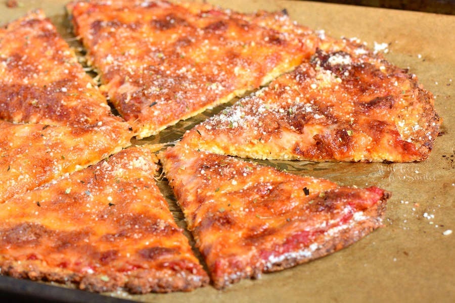 Cauliflower Pizza Crust cheese pizza on parchment paper